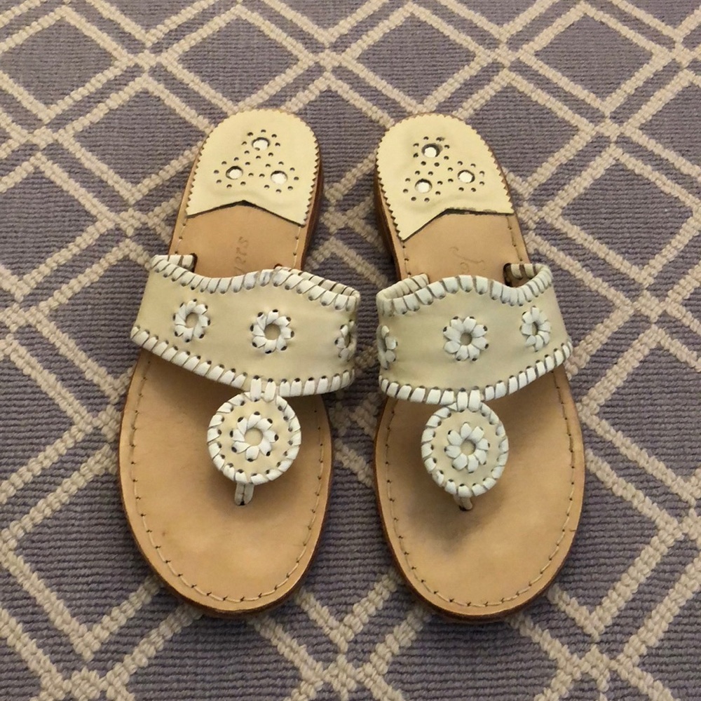 creme and white flip flops